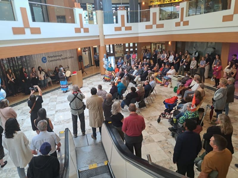 Community members gather in the lower level of Peterborough Square on Oct. 7, 2025, to celebrate the opening of the Peterborough Community Health Centre.